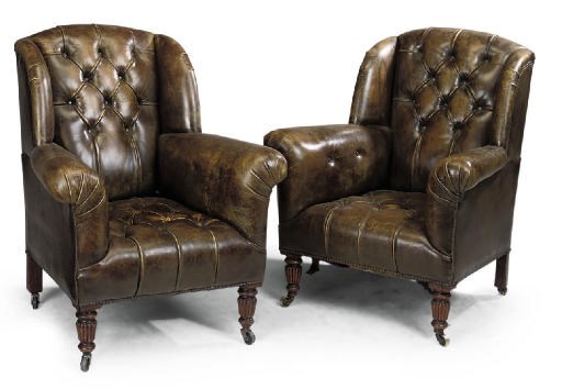 A PAIR OF VICTORIAN LEATHER UPHOLSTERED EASY ARMCHAIRS
