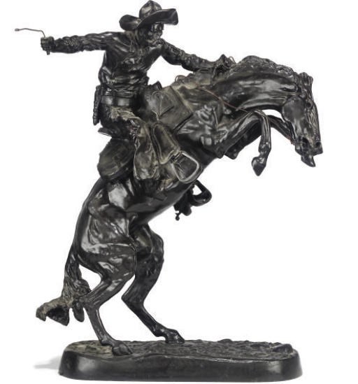 A BRONZE EQUESTRIAN GROUP OF 'BRONCO BUSTER'
