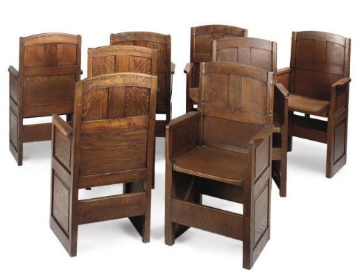 A SET OF TEN OAK PANELLED ARMCHAIRS