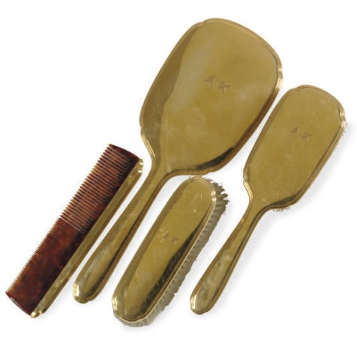 AN AMERICAN GOLD FOUR-PIECE LADIES TOILETTE SET,