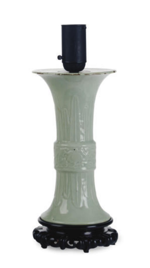 A CHINESE CELADON BEAKER VASE MOUNTED AS A LAMP,