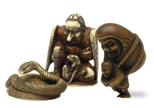 TWO JAPANESE IVORY AND A WOOD NETSUKE,**