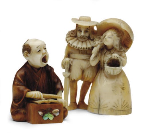 AN IVORY AND A WOOD JAPANESE NETSUKE,**