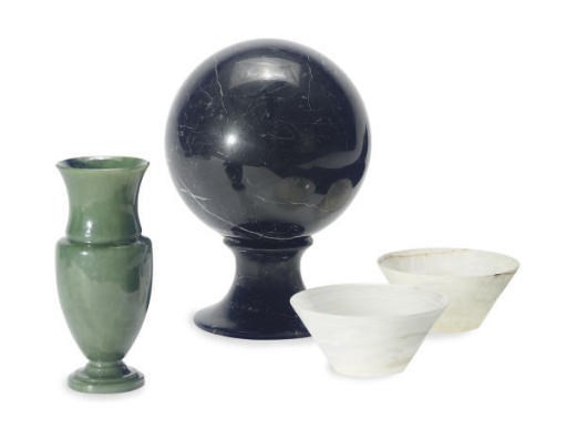A BLACK AND WHITE MARBLE SPHERE ON PEDESTAL,