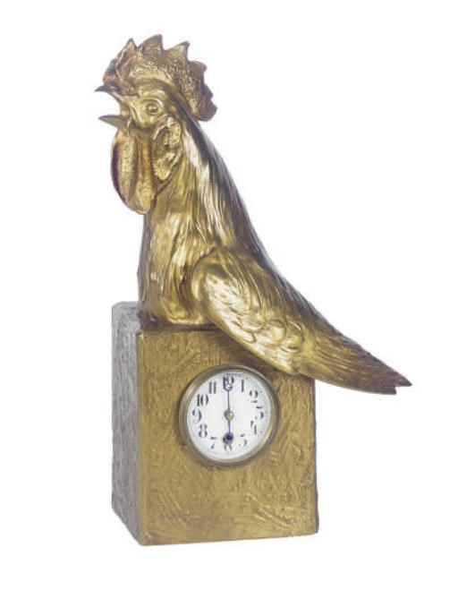 A GILT-METAL FIGURAL TABLE CLOCK,