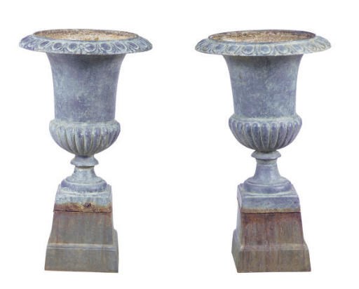 A PAIR OF CAST IRON GARDEN URNS ON STANDS,