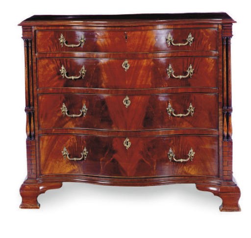 AN ENGLISH MAHOGANY SERPENTINE CHEST-OF-DRAWERS,