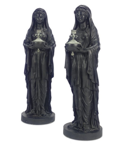 A PAIR OF ENGLISH BLACK-PAINTED PLASTER FIGURAL TORCHERES,