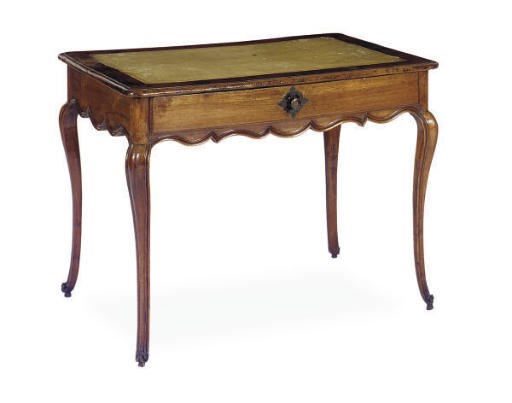 A FRENCH PROVINCIAL WALNUT WRITING TABLE,