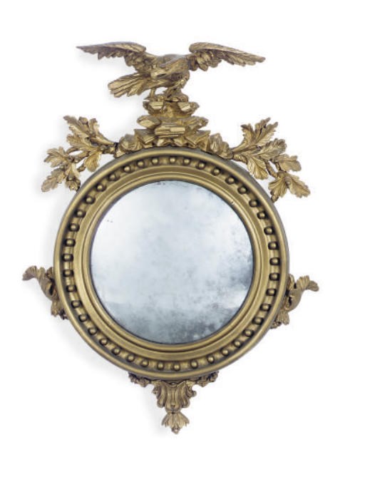 A REGENCY GILTWOOD AND GILT-COMPOSITION CONVEX MIRROR,