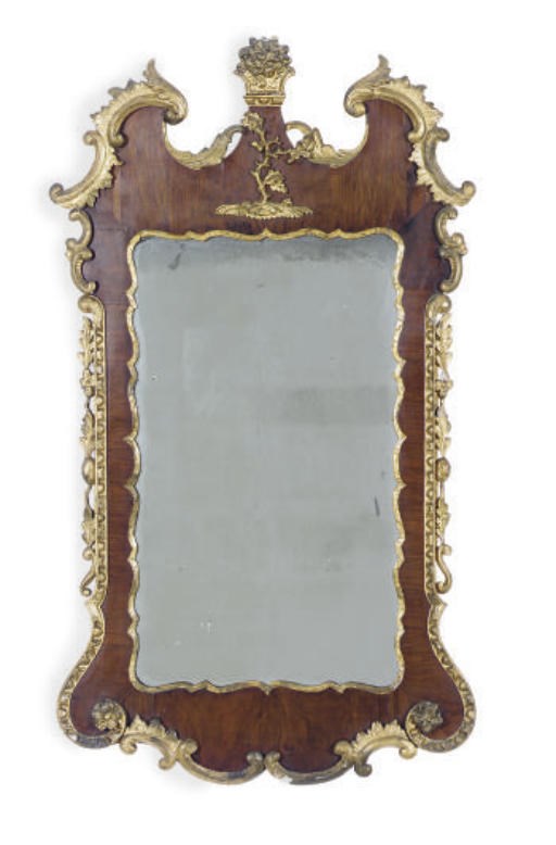A GEORGE II WALNUT AND PARCEL-GILT MIRROR,
