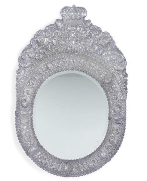 A PAIR OF SOUTH AMERICAN SILVER REPOUSSE MIRRORS,