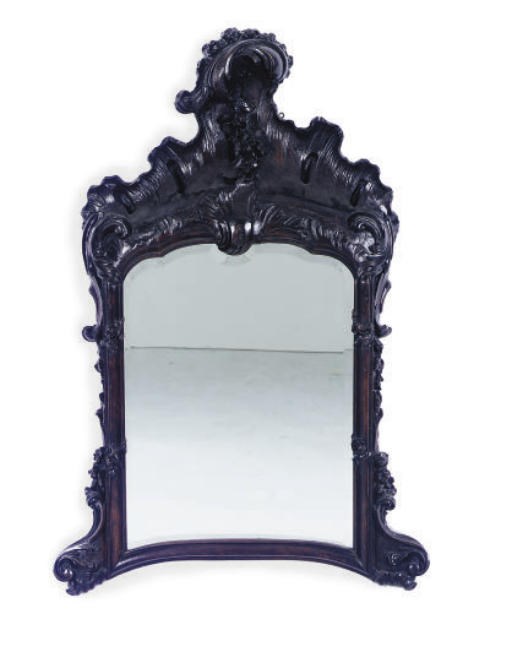 A CONTINENTAL STAINED OAK MIRROR,