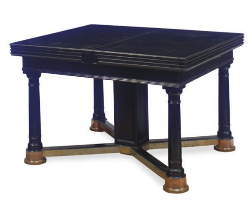 A CONTINENTAL BRASS AND EBONIZED EXTENDING DINING TABLE,
