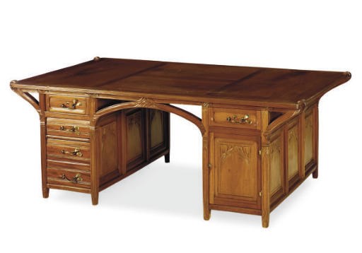 AN ART NOVEAU CHERRY PARTNER'S DESK,