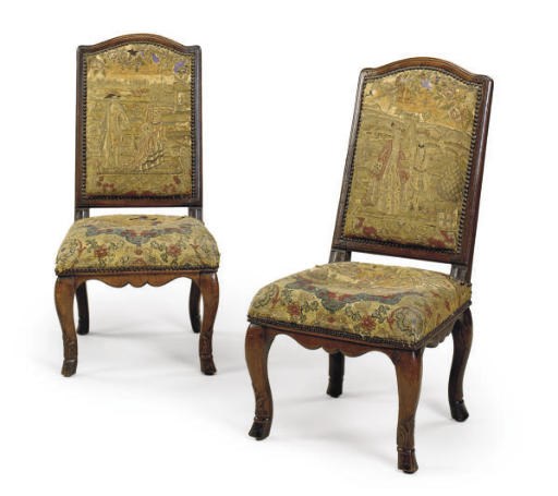 A PAIR OF REGENCE CARVED WALNUT CHAISES,
