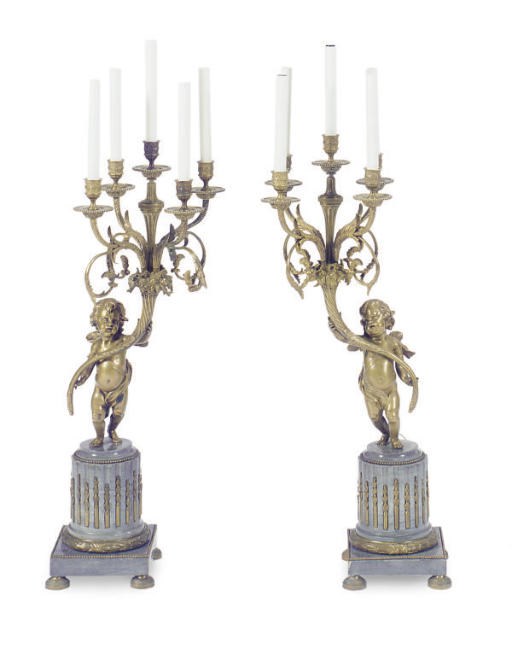 A PAIR OF GILT-BRONZE AND MARBLE FIGURAL FIVE-LIGHT CANDELABRA,