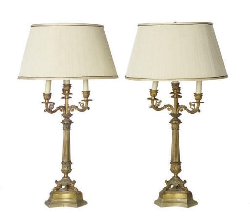 A PAIR OF GILT-BRONZE CANDELABRA MOUNTED AS LAMPS,