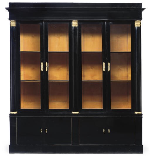 AN AUSTRIAN GILT-METAL MOUNTED EBONISED BOOKCASE
