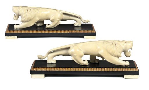 A PAIR OF INDIAN IVORY LIONS