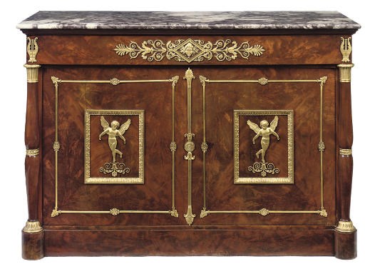 AN EMPIRE ORMOLU-MOUNTED MAHOGANY COMMODE À VANTAUX