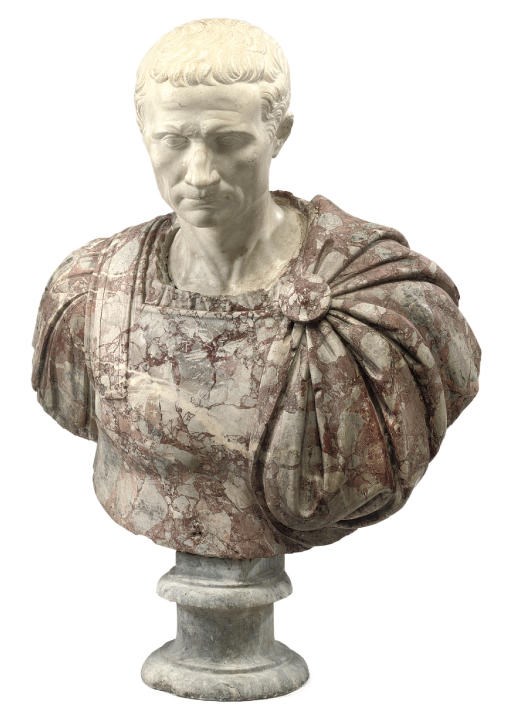 AN ITALIAN WHITE AND HARLEQUIN BRECCIA MARBLE BUST OF JULIUS CAESAR