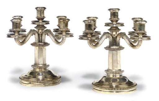 A PAIR OF SPANISH SILVER FIVE-LIGHT CANDELABRA