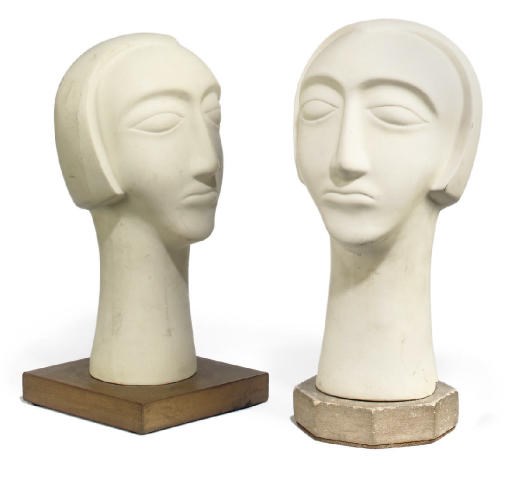 TWO PLASTER HEADS OF WOMEN