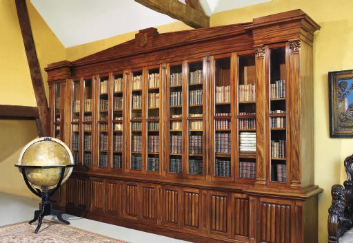 AN IRISH GEORGE IV MAHOGANY BREAKFRONT BOOKCASE