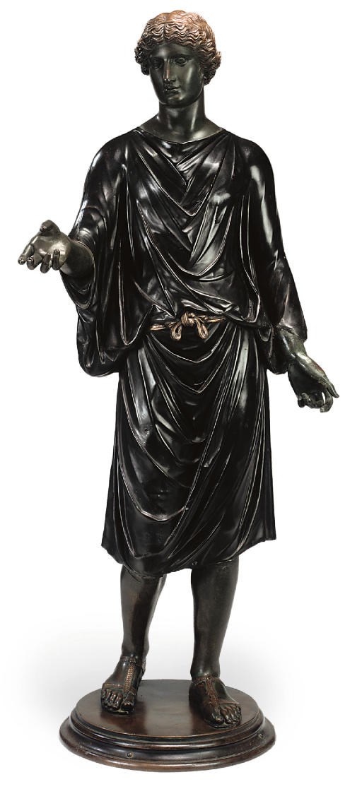 AN ITALIAN PATINATED COPPER FIGURE OF A CAMILLUS