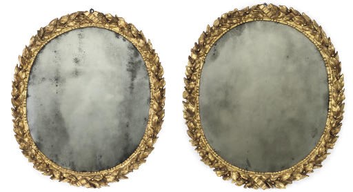A PAIR OF ITALIAN GILTWOOD OVAL MIRRORS