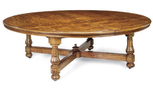 AN IRISH BROWN OAK EXTENDING DINING-TABLE