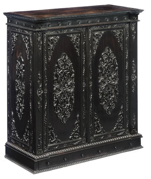AN ANGLO-INDIAN FOLIATE-CARVED EBONY CABINET