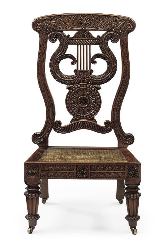 AN ANGLO-INDIAN FOLIATE-CARVED PADOUK LOW CHAIR