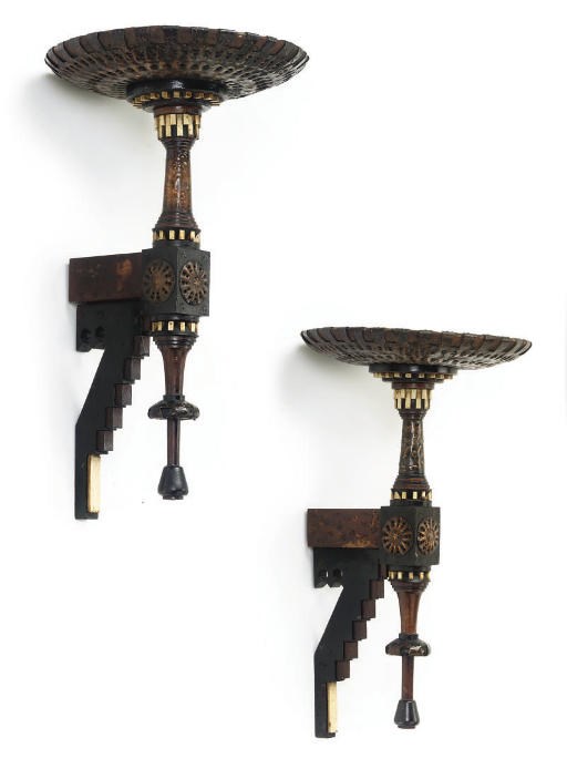 A PAIR OF CARLO BUGATTI COPPER, EBONISED WOOD AND BONE WALL BRACKETS