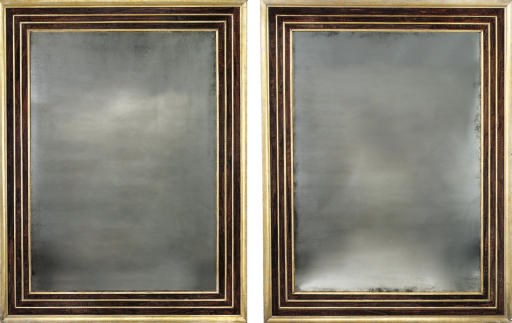 A PAIR OF ITALIAN SILVER-GILT AND GRAINED MIRRORS