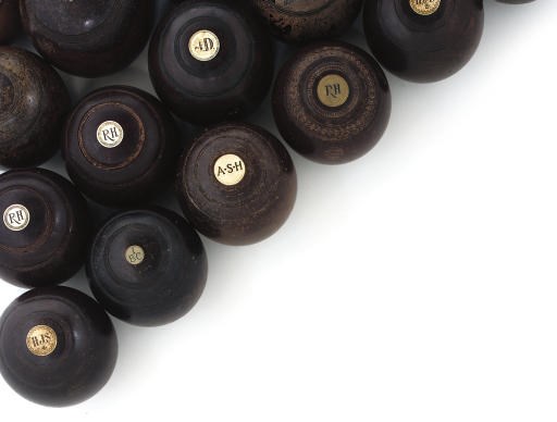 A COLLECTION OF TWENTY-FIVE LIGNUM VITAE LAWN BOWLS