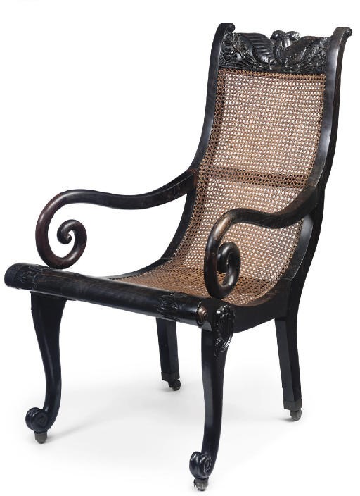 AN ANGLO-INDIAN EBONY OPEN ARMCHAIR