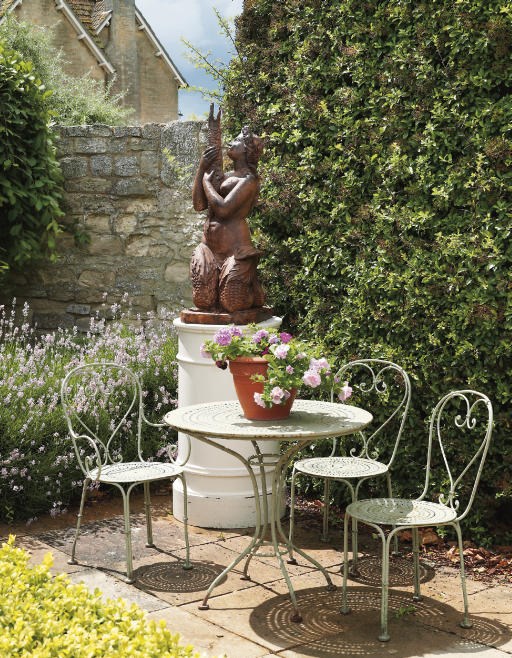 AN ITALIAN CAST-IRON FOUNTAIN FIGURE OF A MERMAID HOLDING A FISH