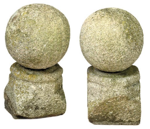A PAIR OF CARVED GRIT STONE OR GRANITE PIER FINIALS