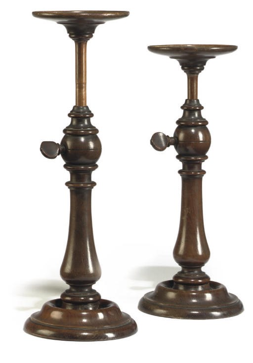 A PAIR OF EARLY VICTORIAN MAHOGANY CANDLE STANDS