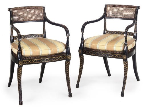 A PAIR OF REGENCY EBONISED AND PARCEL-GILT ARMCHAIRS