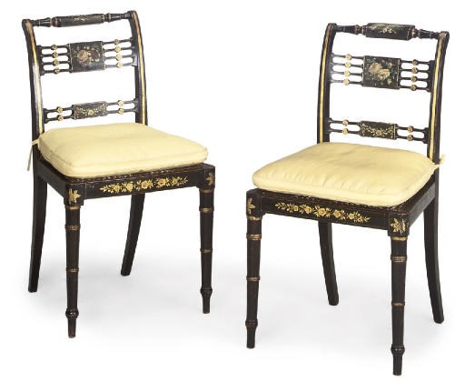 A PAIR OF REGENCY EBONISED AND PARCEL GILT SIDE CHAIRS