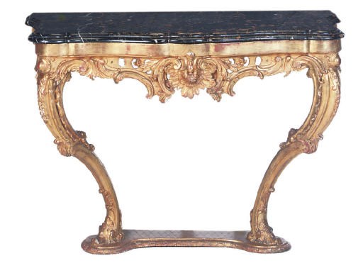 A NORTH EUROPEAN CARVED GILTWOOD SERPENTINE CONSOLE TABLE