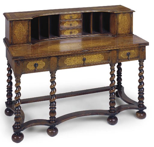A WALNUT AND SEAWEED MARQUETRY DESK