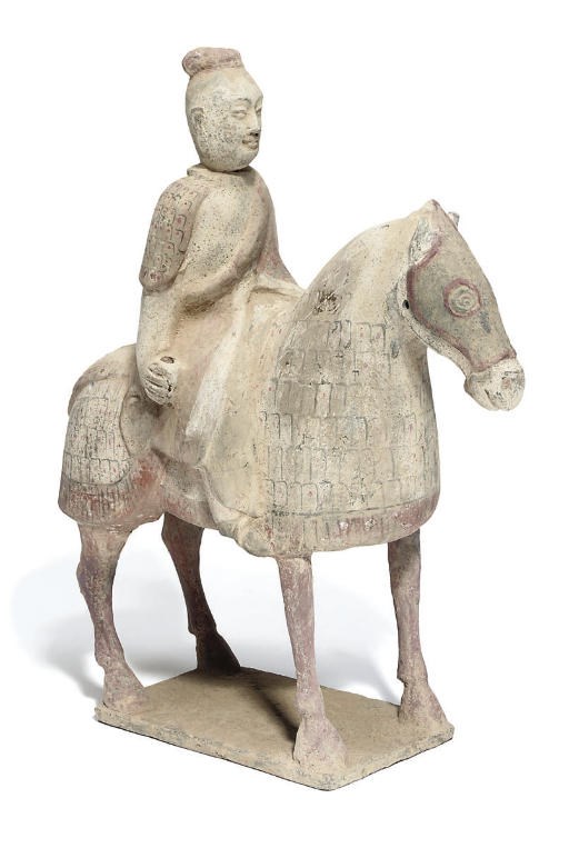 A Chinese painted pottery horse and rider