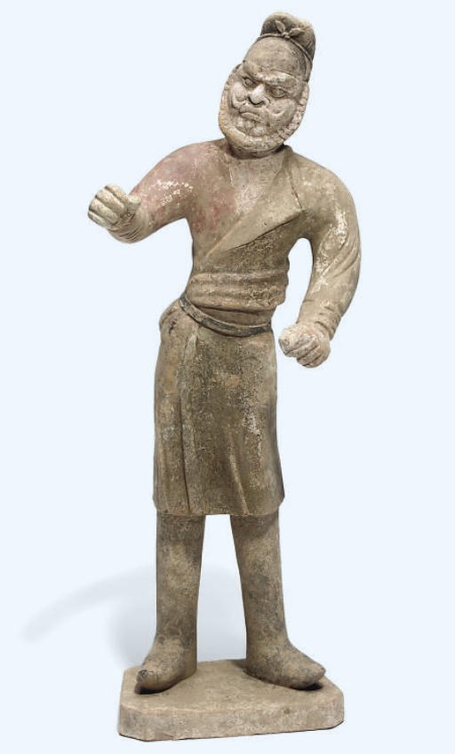 A large Chinese painted pottery figure of a groom