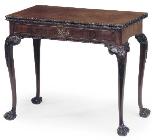 A GEORGE II MAHOGANY TEA TABLE