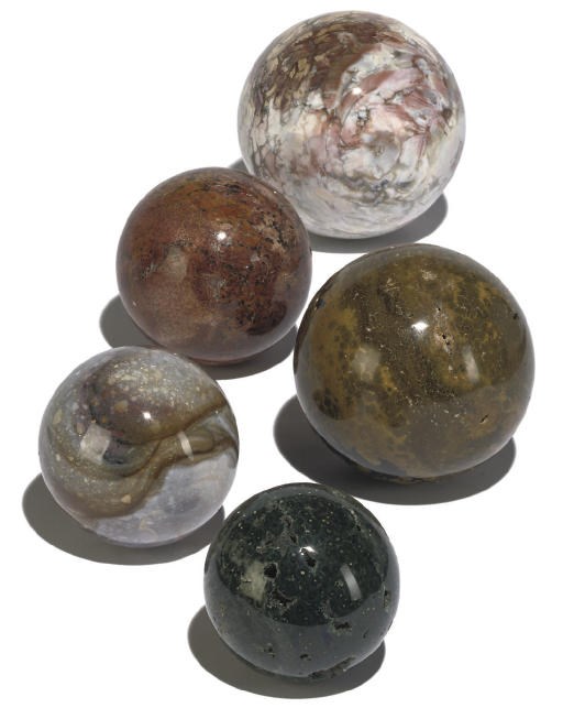 A GROUP OF FIVE MINERAL SPECIMEN SPHERES OF OCEAN JASPAR