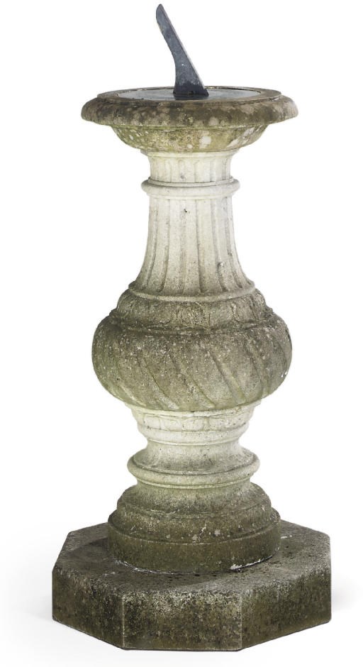 A LIMESTONE SUNDIAL PEDESTAL